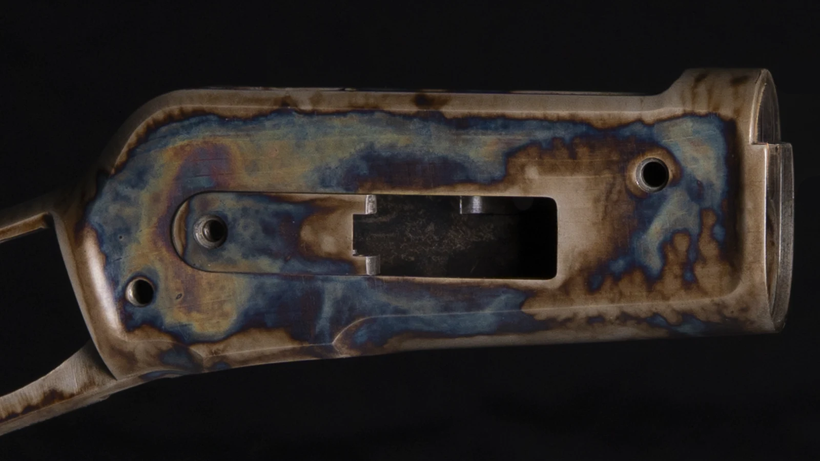 Right side of a Winchester 1886 receiver with bone charcoal color case hardening